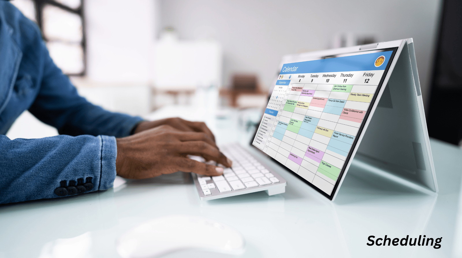 Male hands using a scheduling tool on a laptop.